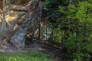 devil stone in a forest in the mountains of Pogorzyce in Poland on a summer day photo