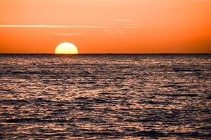 Sunset over the sea photo