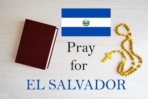 Pray for El Salvador. Rosary and Holy Bible background. photo