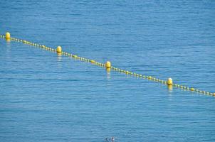 Floating border marks in the sea. photo