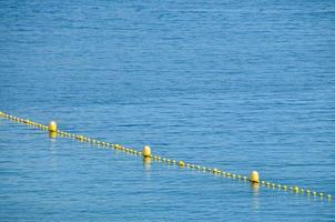 Floating border marks in the sea. photo