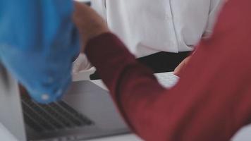 Financial analysts analyze business financial reports on a digital tablet planning investment project during a discussion at a meeting of corporate showing the results of their successful teamwork. video