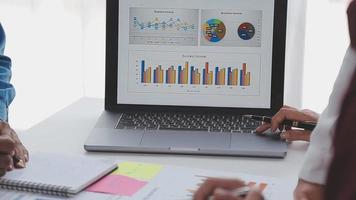 Financial analysts analyze business financial reports on a digital tablet planning investment project during a discussion at a meeting of corporate showing the results of their successful teamwork. video