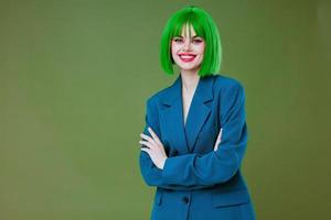 Portrait of a charming lady fun gesture hands green hair fashion color background unaltered photo