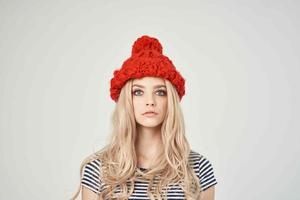 blonde in fashionable clothes Red Hat posing Studio photo