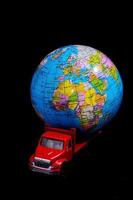 Red toy truck with a globe photo