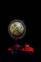 Red toy truck with a globe photo