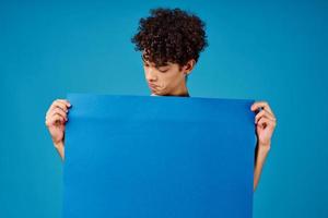 guy holding blue banner advertisement copy space isolated background photo