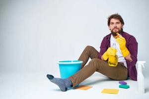 cleaner lying on the floor with a bucket of detergent cleaning service rendering Professional photo