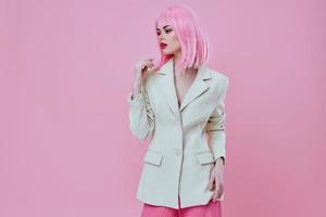 Portrait of a charming lady in a suit makeup pink hair posing color background unaltered photo