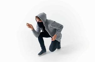 a man in a mask with a hood on his head thief hacking photo