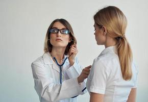 Woman professional doctor with glasses stethoscope patient health photo