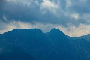 landscape of the Tatra Mountains and Giewont  on a warm summer cloudy holiday day photo
