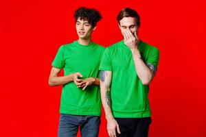two men green t-shirt communication studio team photo