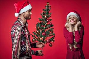 woman next to man family portrait christmas tree decoration holiday photo