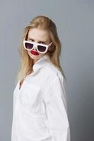 pretty woman in white shirt sunglasses isolated background photo