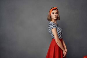 woman in striped t-shirt with orange headband fashion glamor photo