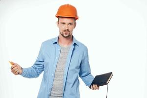 man in construction uniform protection light background photo