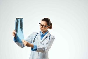 medical worker in white coat x-rays professional examination photo