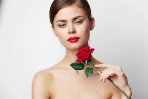 Woman with rose Bare shoulders holiday bright makeup photo