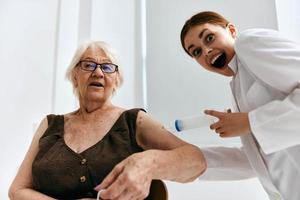 nurse injecting older woman big syringe fun photo