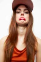 Beautiful woman in a cap Sad face antics fashionable clothes photo