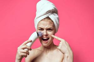 woman with bare shoulders cleaning skin spa treatments pink background photo