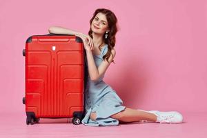 woman tourist red suitcase passenger travel fun lifestyle photo