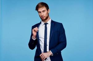 handsome man in suit self-confidence official blue background photo