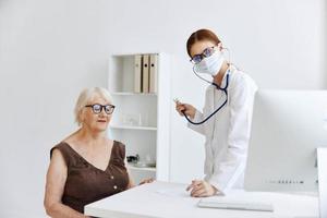 female doctor stethoscope in hand health care photo