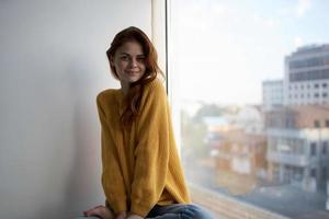 red-haired woman in a yellow sweater Lifestyle photo