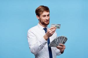 Virgo man in tie with money in hands wealth success self-confidence photo