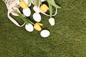 eggs with flowers on the grass christian holiday easter top view photo