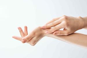 female hands skin care moisturizing medicine close-up photo