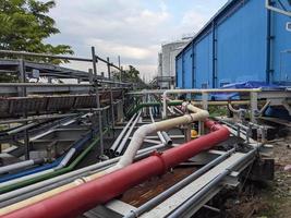 Pipe rack and pipe installation on the construction power plant project. The photo is suitable to use for industry background photography, power plant poster and electricity content media.