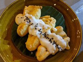 Banana Fries traditional food of Javanese with creamy topping and Choco chips. The photo is suitable to use for traditional food background, poster and food content media.