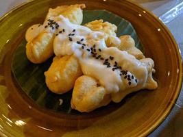 Banana Fries traditional food of Javanese with creamy topping and Choco chips. The photo is suitable to use for traditional food background, poster and food content media.