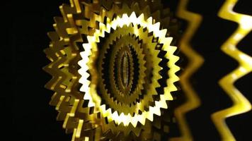 an abstract gold shiny spinning pattern, great for backdrops, parties and events video