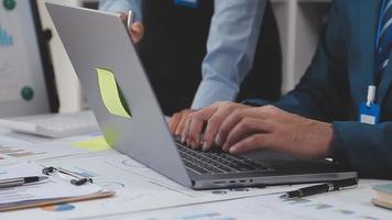 Financial analysts analyze business financial reports on a digital tablet planning investment project during a discussion at a meeting of corporate showing the results of their successful teamwork. video