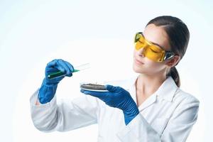 female laboratory assistant in a white coat soil research biology photo