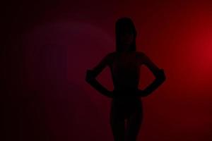 Neon scene silhouette woman red light photo