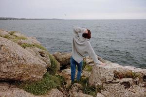 beautiful woman nature rocks coast landscape Ocean female relaxing photo