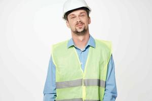 man reflective vest blueprints builder light background photo