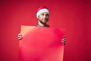 handsome man in New Year's clothes advertising copy space red background photo