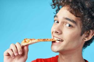 guy with curly hair bird in hands fast food delivery photo