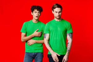 two men green t-shirt communication studio team photo