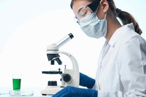 woman laboratory assistant microscope diagnostics chemistry research photo