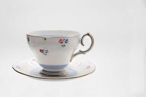 Old style tea cup isolated on a white background. photo