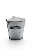 Close up shot of ice bucket isolated on a white background. photo