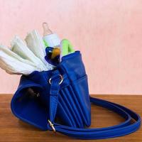 Women's handbag with items to care for the child photo